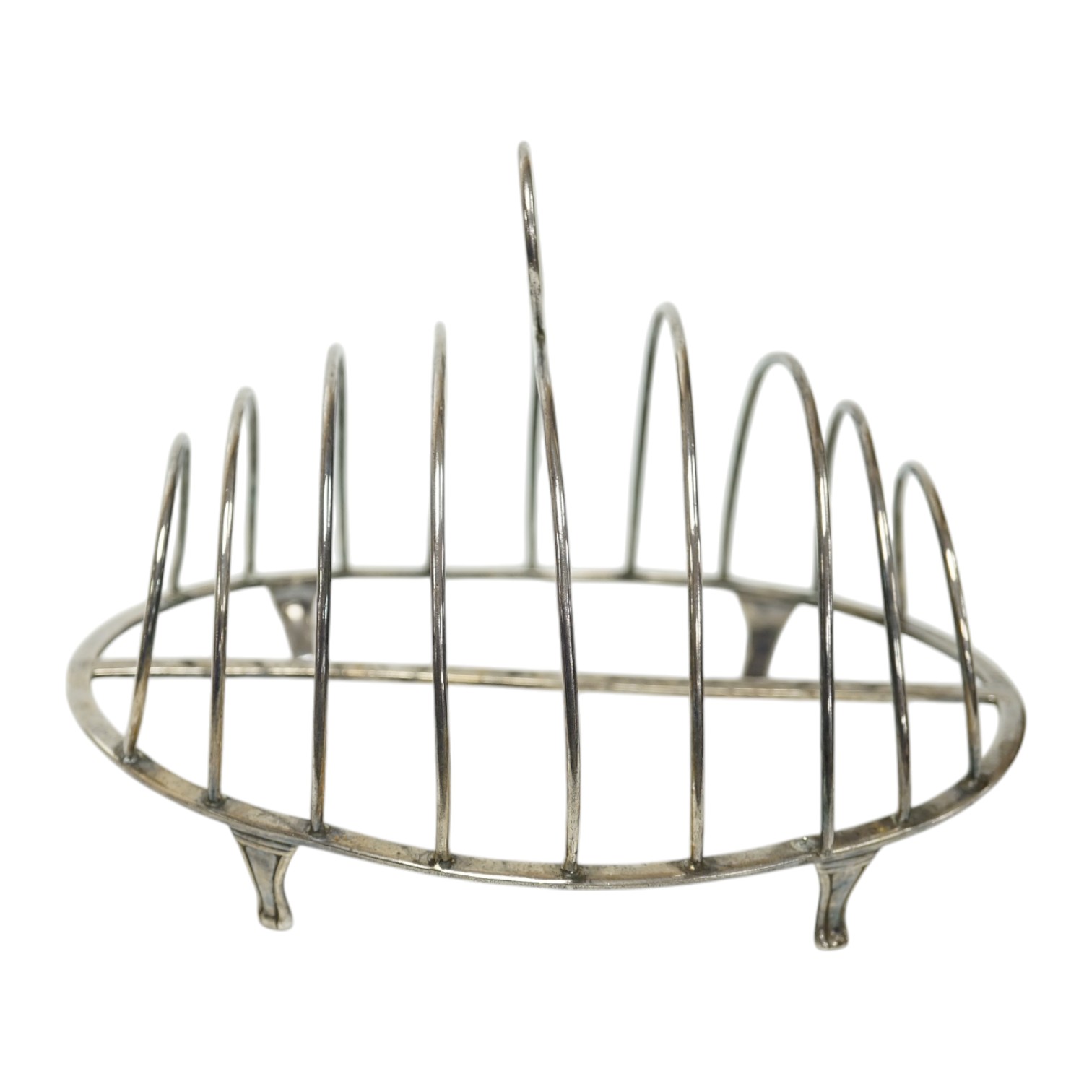 A George III silver oval nine bar toast rack by Robert & Samuel Hennell, with crescent ring handle, on four tapering feet, London, 1803, length 18.4cm. Condition - poor to fair